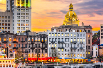 A river view of River Street in Svannah Georgia in the evening sunset